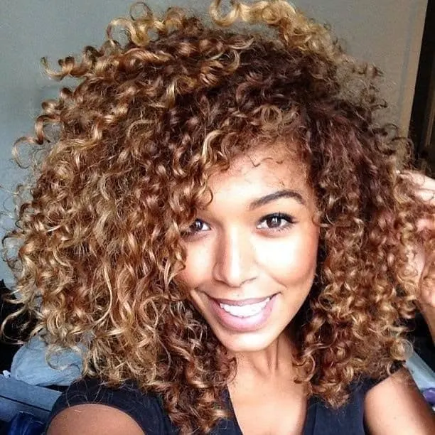 Tawny Gold curly hairstyle 