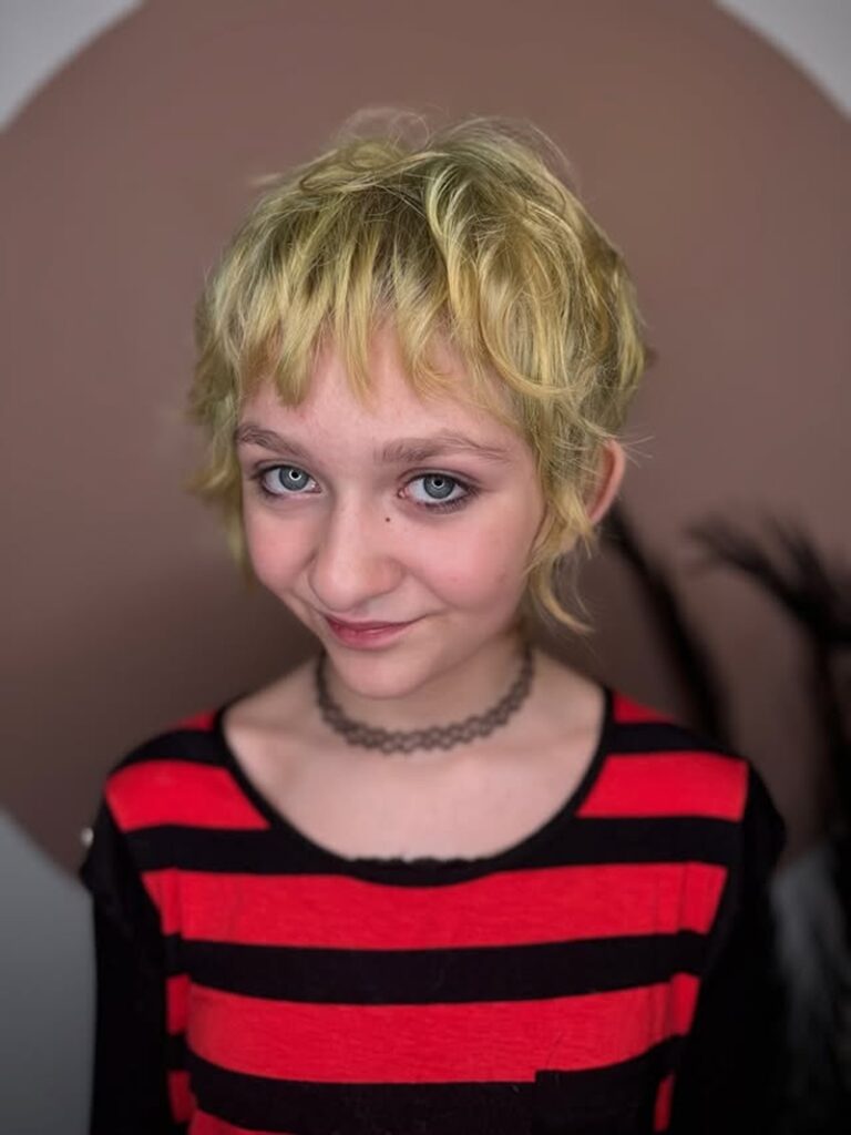 10 year old girl with a blonde shaggy pixie haircut