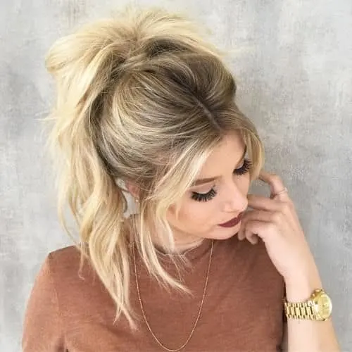 loose ponytail with bangs hairstyle