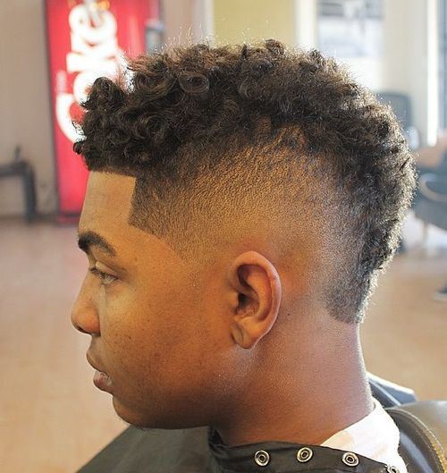 mens curly taper fade hairstyle