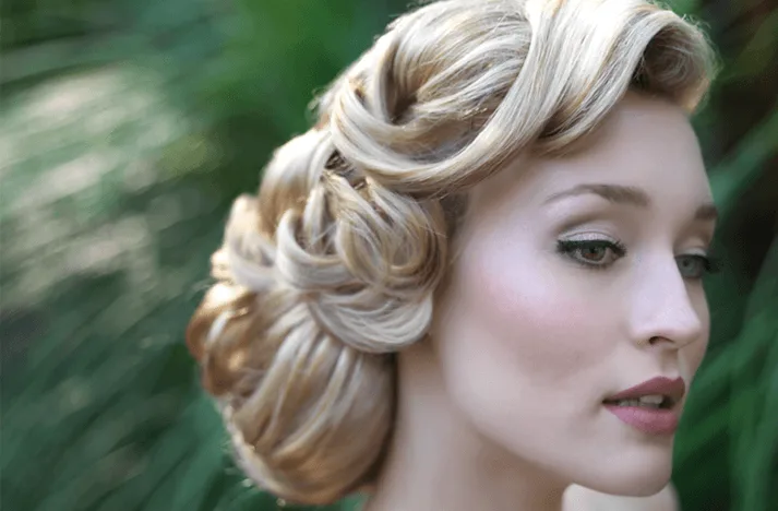 Low curly bun vintage wedding hairstyles for women 