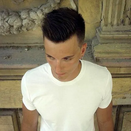  Medium taper fade with spiky comb over hairstyle for men 