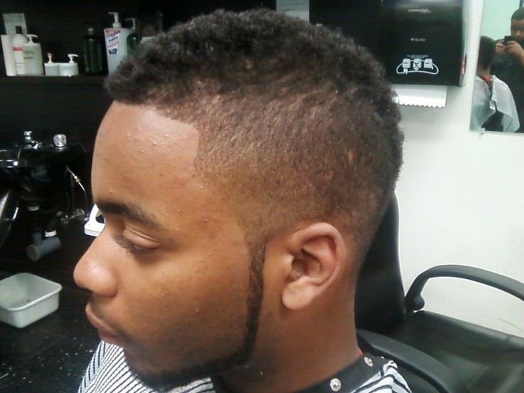 Tapered fohawk hairstyle for black young boy