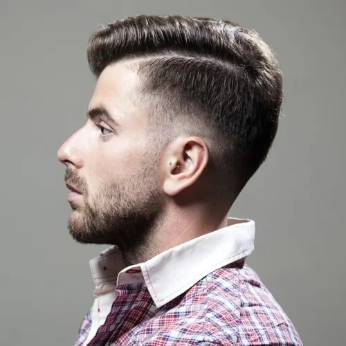 low blowout haircut with faux hawk hairstyle