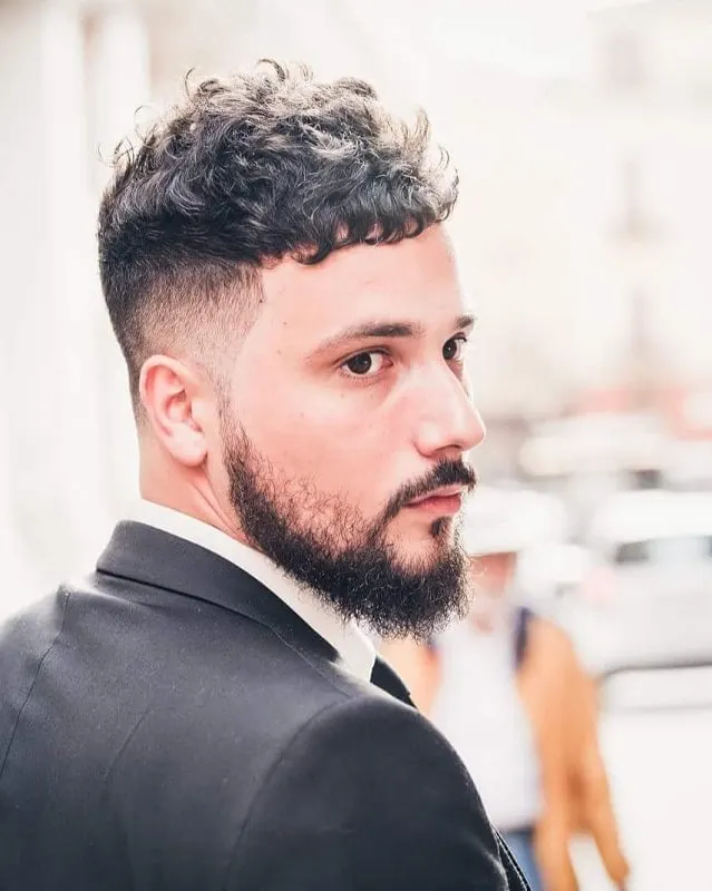 short wavy hairstyle with beard