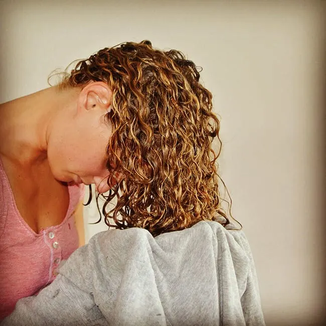 Blow dry curly hair with a towel 