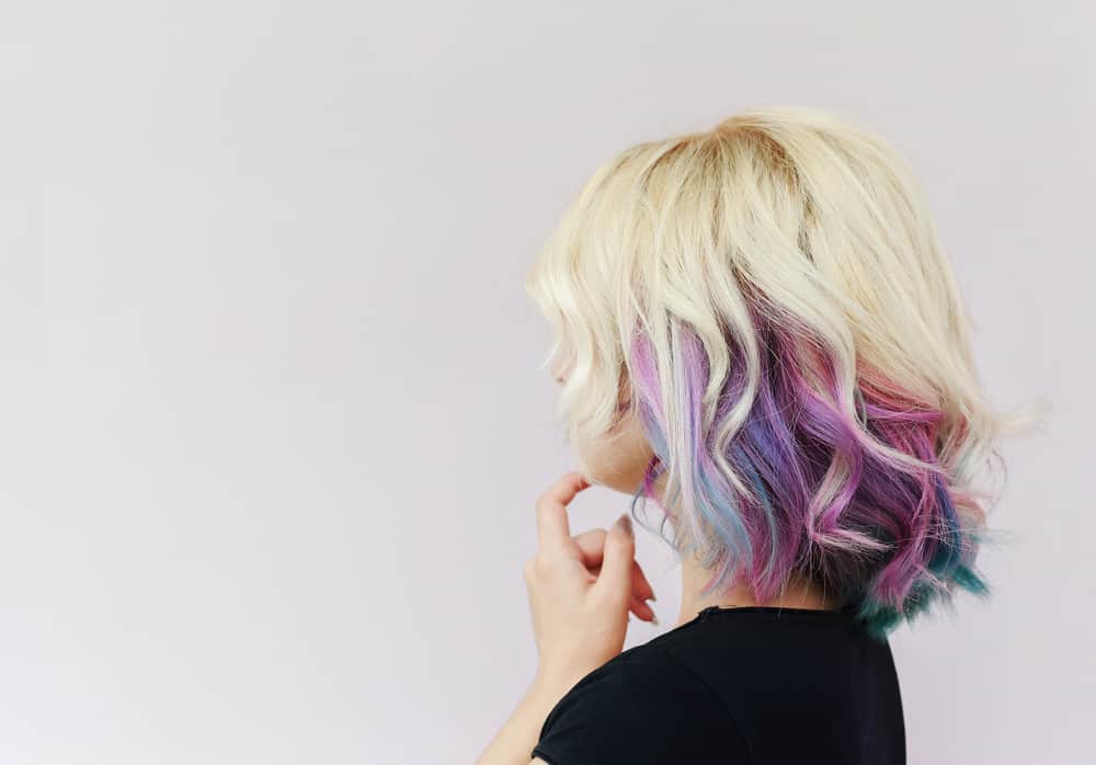 blonde hair with purple highlights underneath