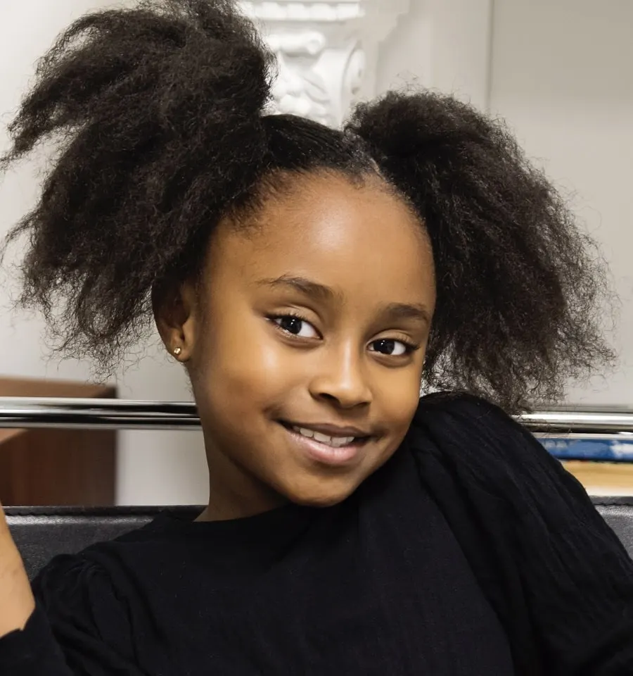 8 year old black girl with afro pigtails