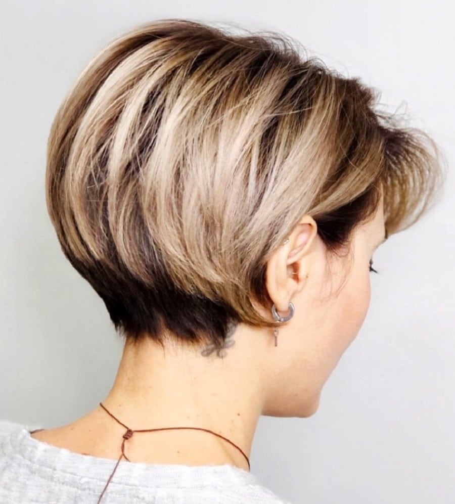 80s wedge cut with blonde highlights