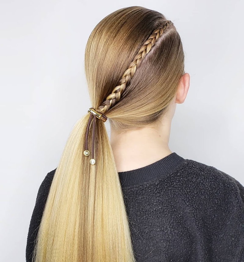 low blonde ponytail detailed with a tight side accent braid