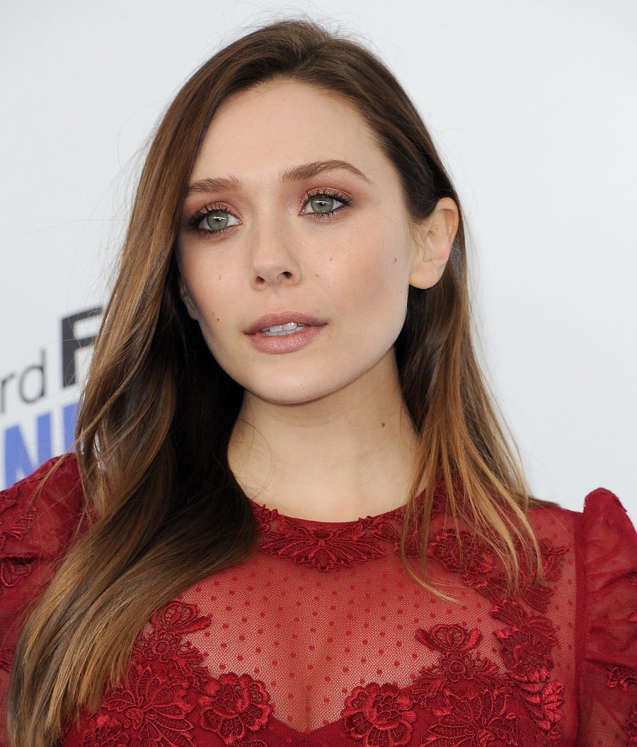 Actress Elizabeth Olsen with straight brown hair and green eyes