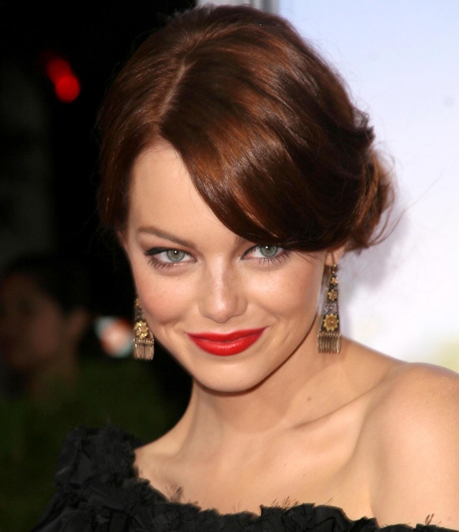 Actress Emma Stone with brown hair and green eyes