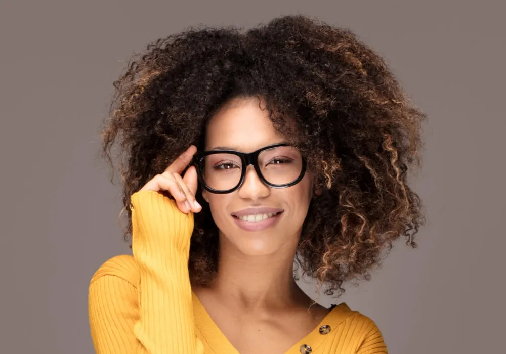 Afro bob for oval face with glasses