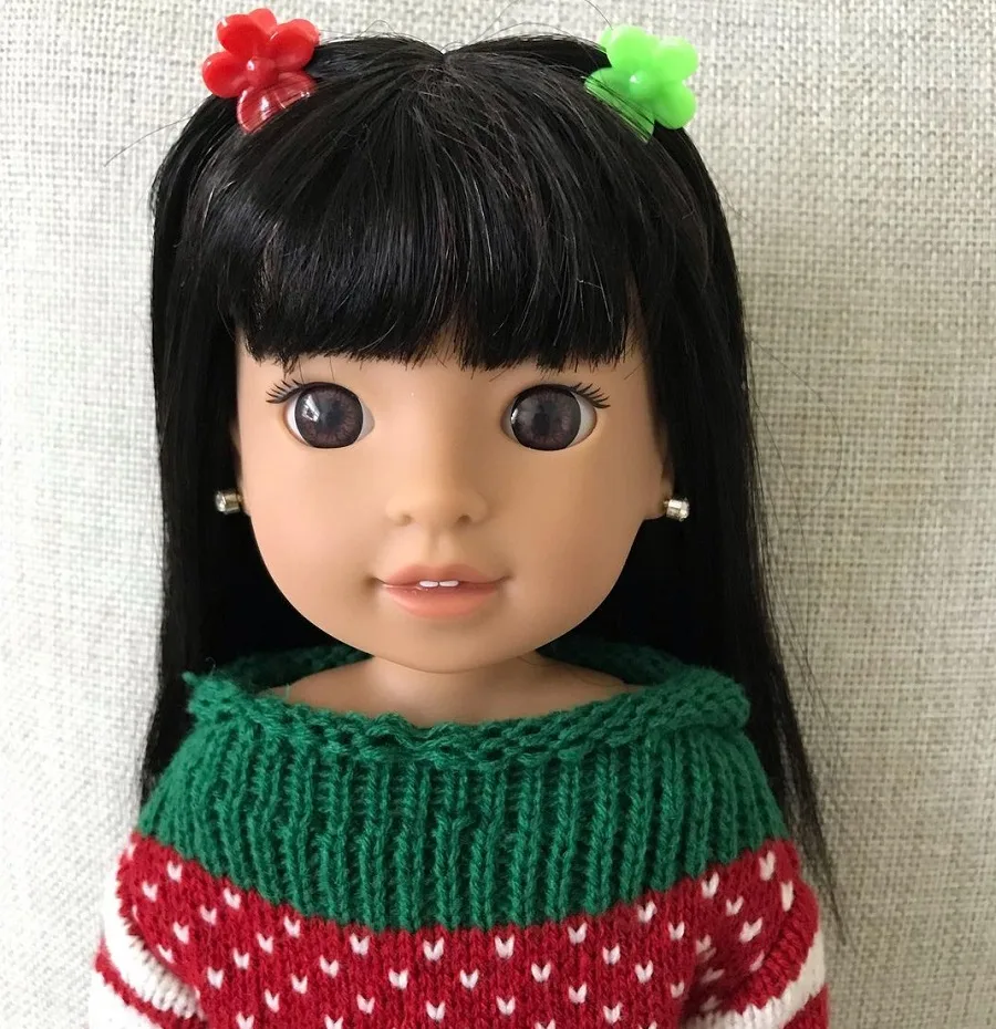 American girl doll with dark hair and blunt bangs