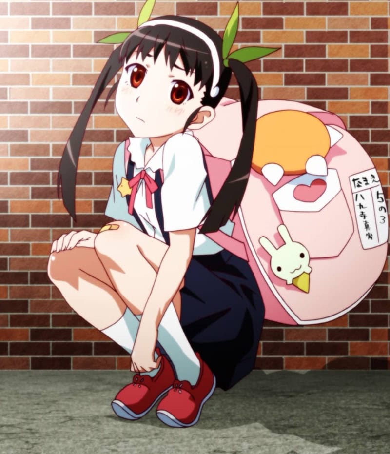 Mayoi Hachikuji with dark hair styled in long, thin pigtails secured by a headband with blunt bangs