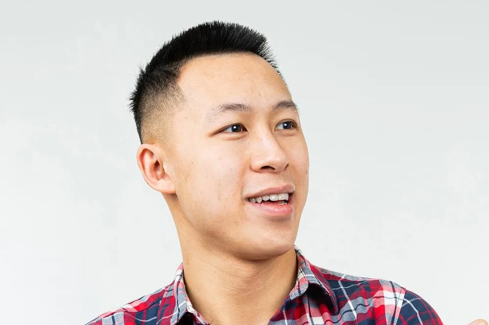 Asian guy with short hair and bald fade