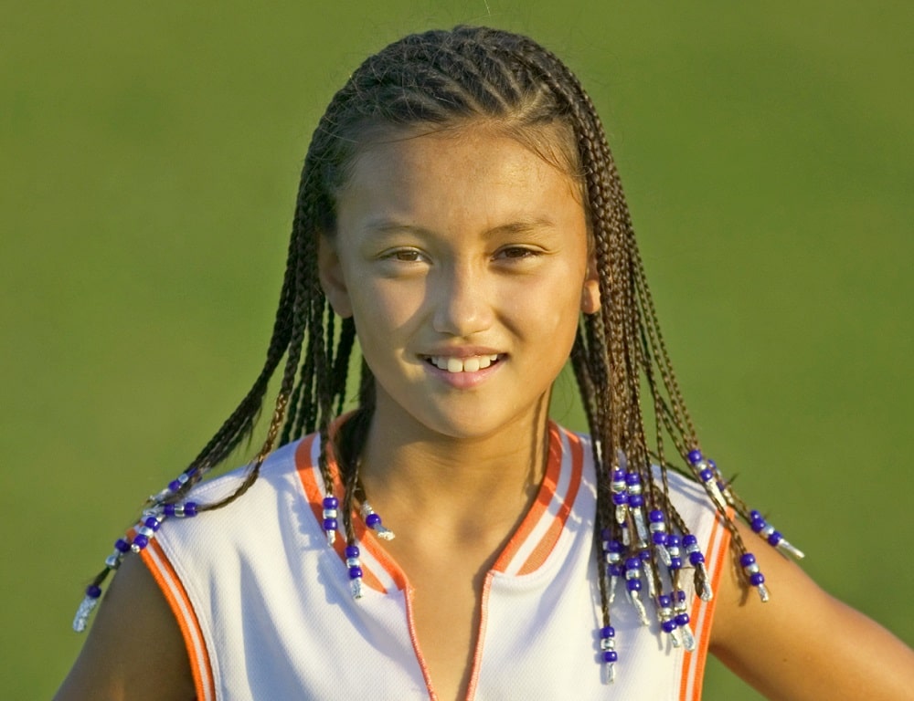 Asian little girl's braids with beads