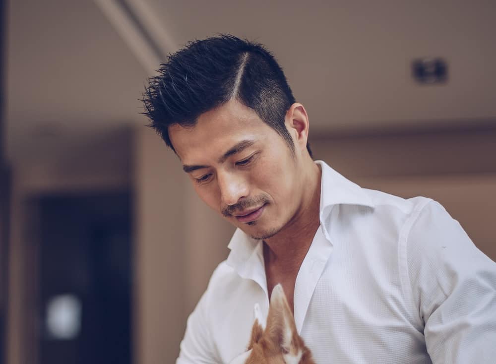 Asian men's hairstyle with hard part