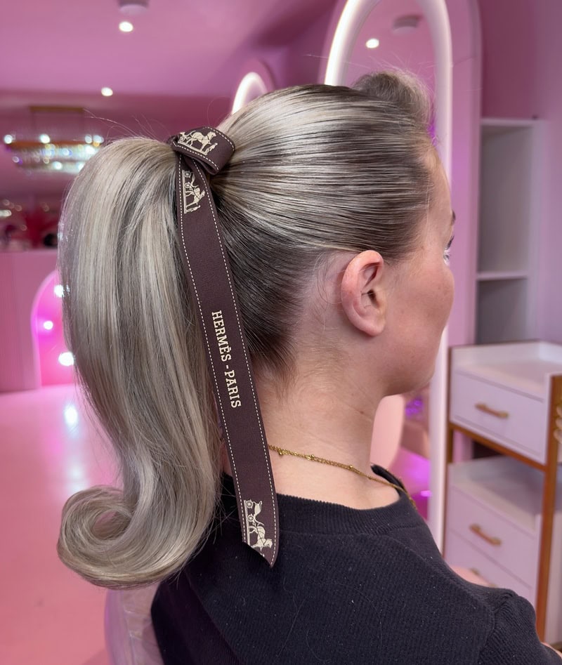 High blonde Barbie ponytail with flipped ends