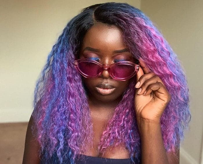 blue and purple on curly hair