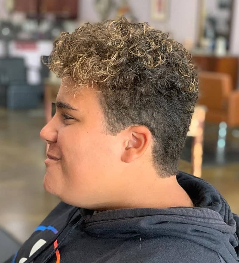 Boys aged 16 year old with curly tapered hair