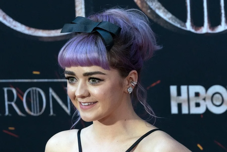 The famous Maisie Williams with purple hair
