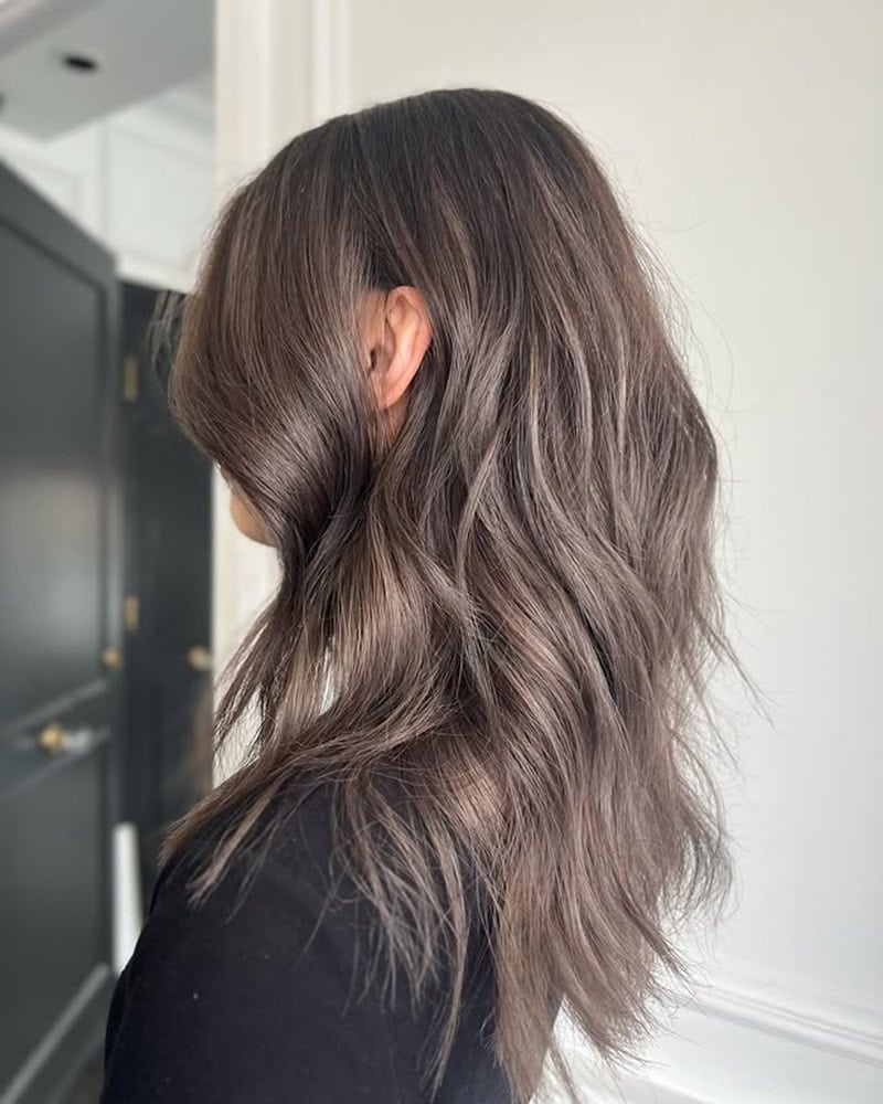 medium-length, wavy mushroom brown hair with ash undertones.