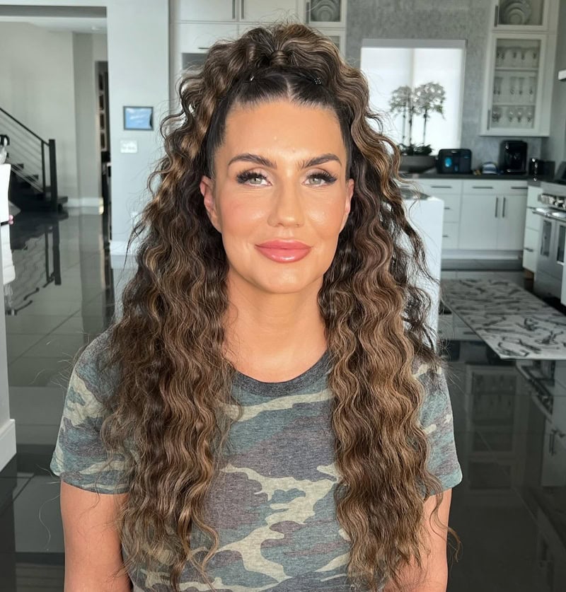 High, voluminous brunette ponytail with a deeply crimped texture