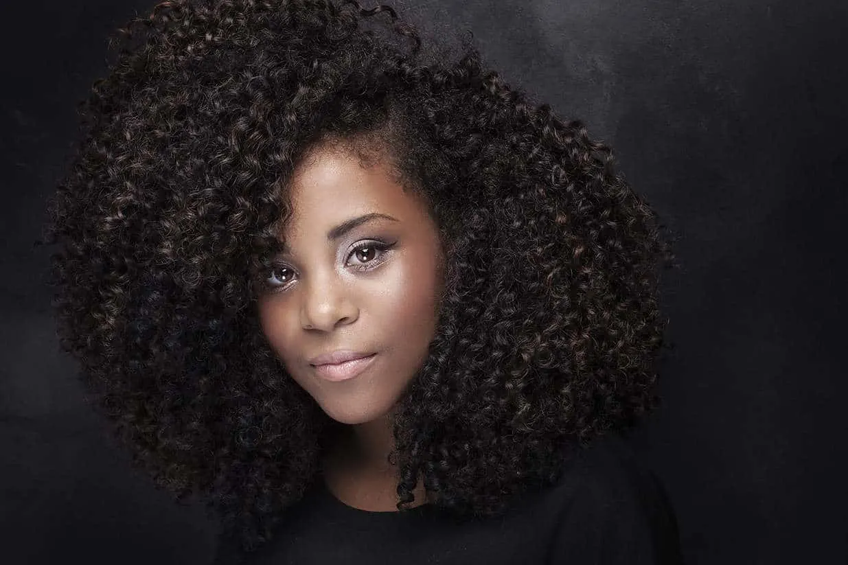 Medium Length Curly Hairstyle for young black girl