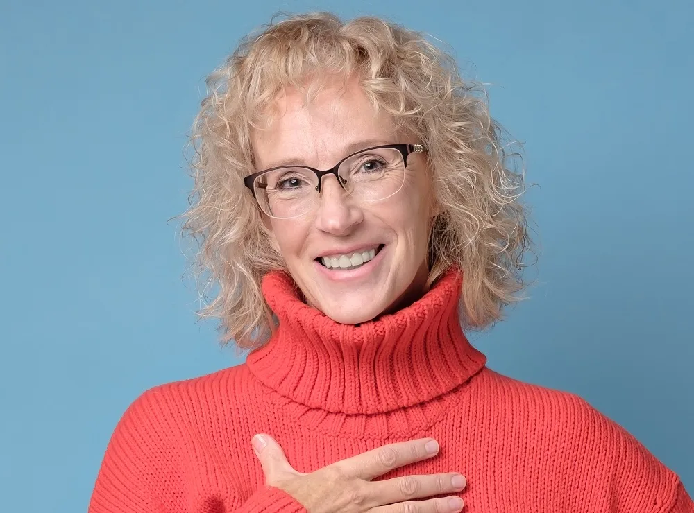 Curly lob for over 60 with glasses