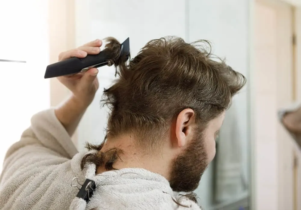 Cutting back hair with clippers