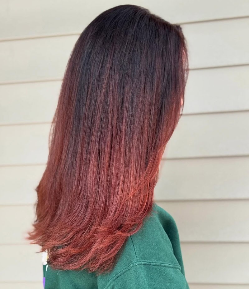 Straight dark hair melting into red auburn ends