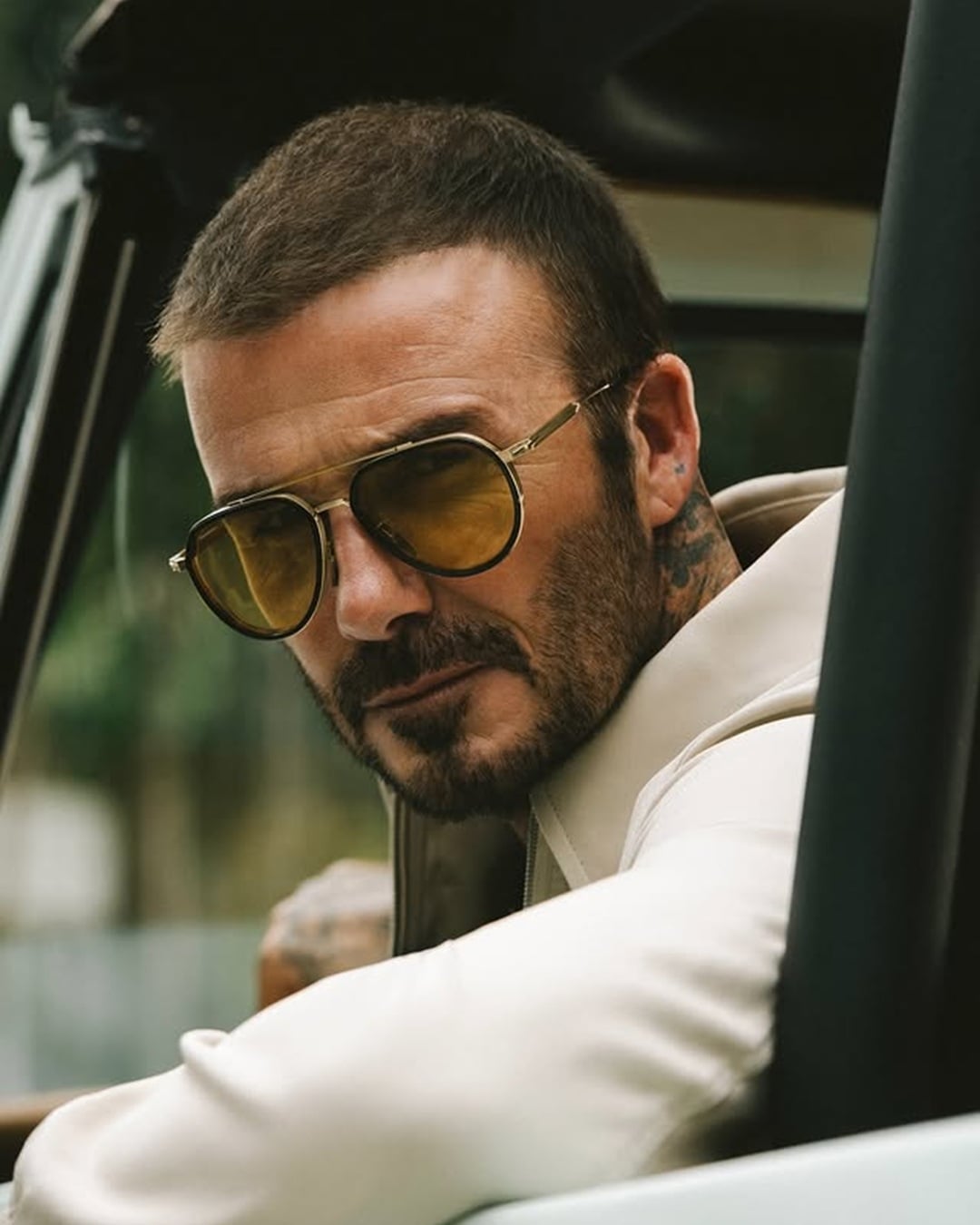 David Beckham with a long buzz cut haircut and light stubble