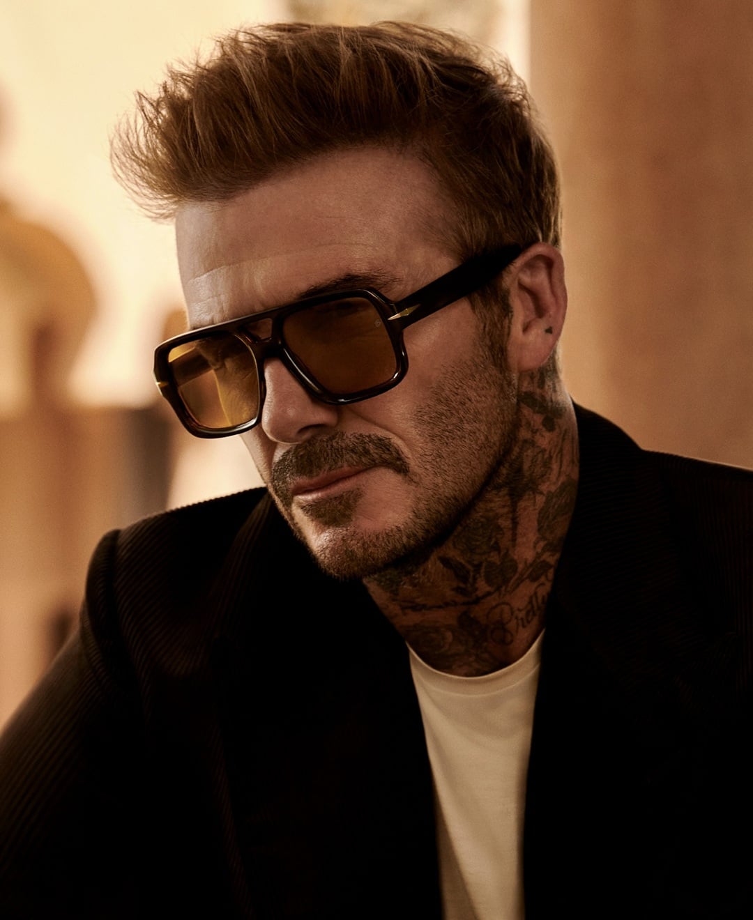 David Beckham with textured brush-up hairstyle with a short beard
