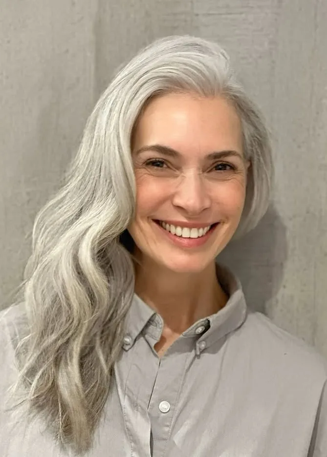 Older women with deep side part and silver layers