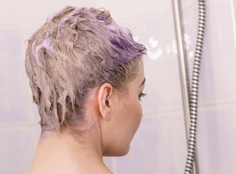 removing yellow tones with purple shampoo