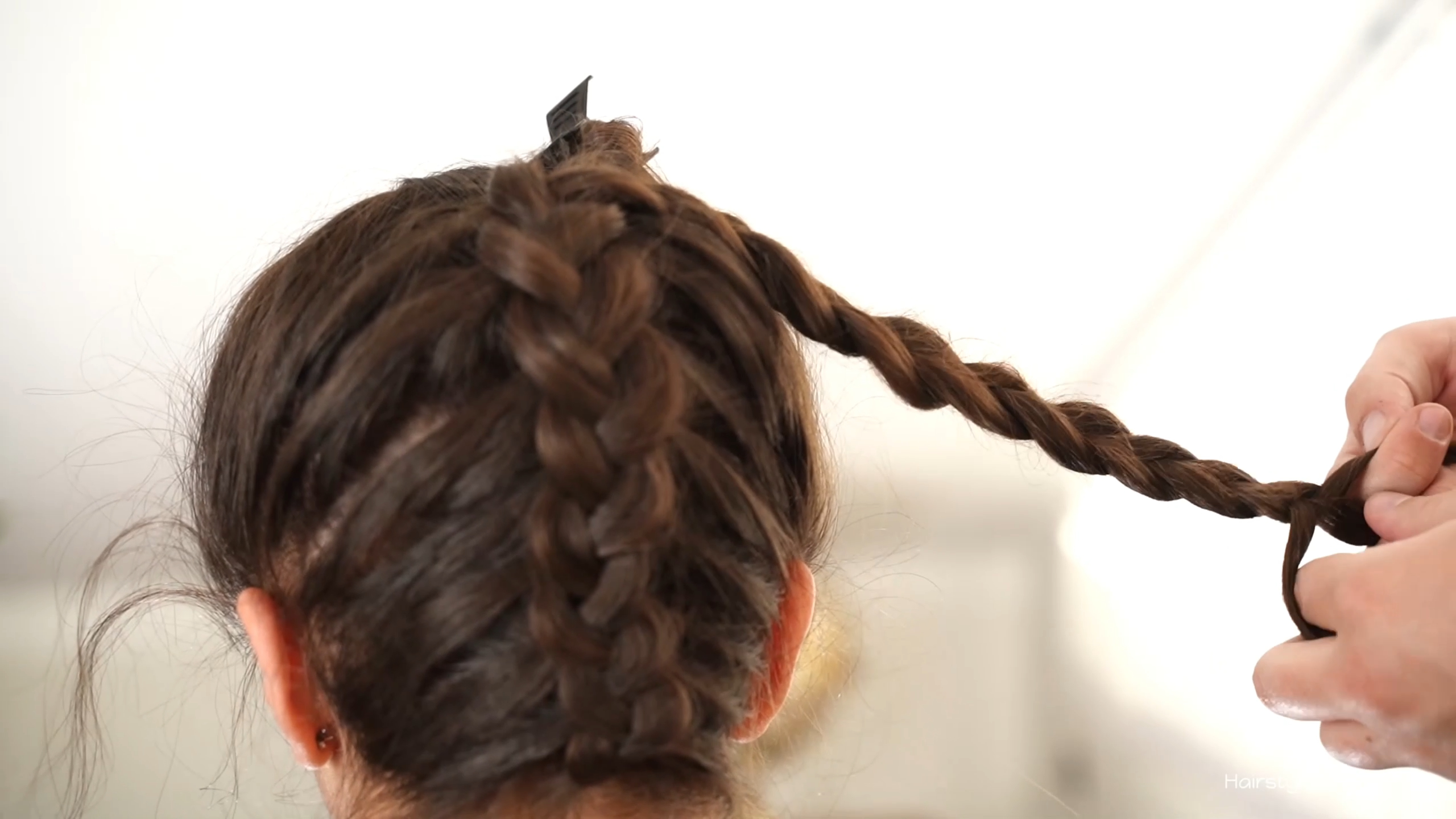 Upside-down Dutch braid completed to the crown with the remaining length finished in a regular braid.