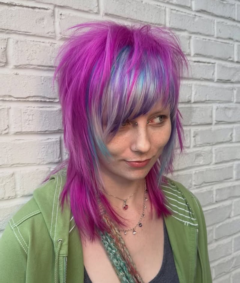 spiky purple scene hair with blue streaks and deep side bangs