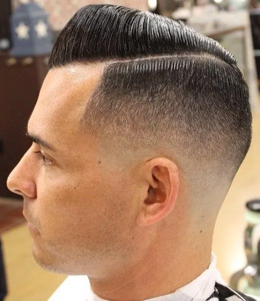 fade haircut with side part