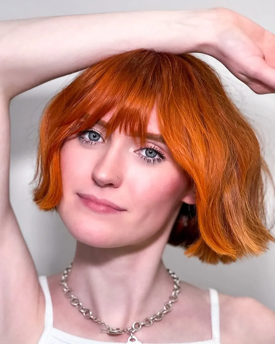 French red bob with bangs