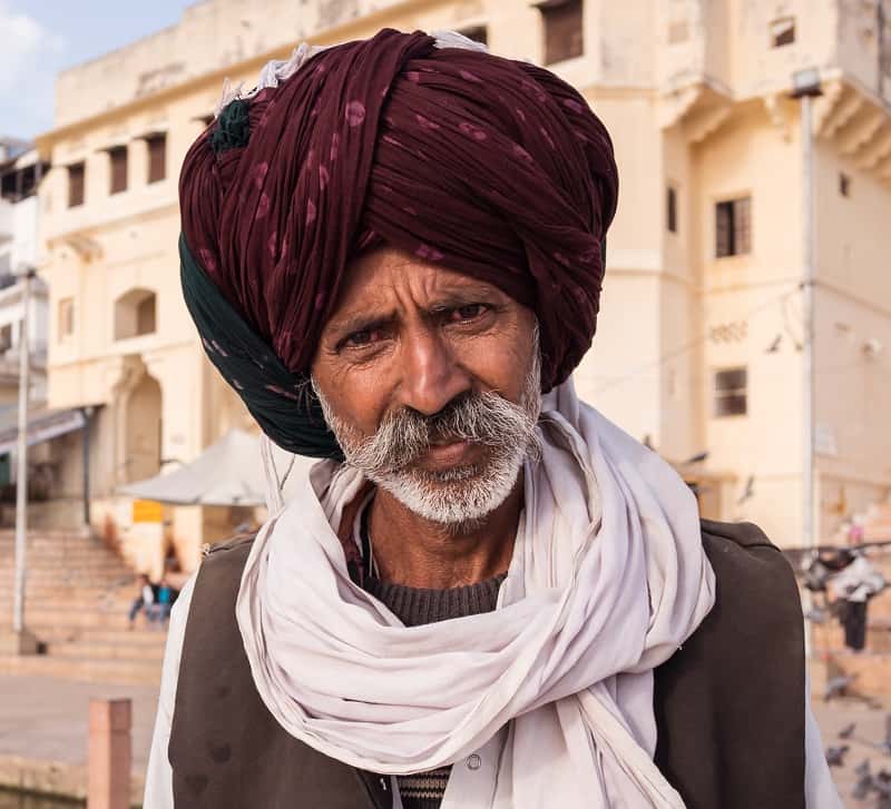 Indian man with short beard and long mustache