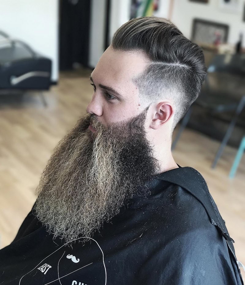man with long full beard with slicked-back undercut and hard part
