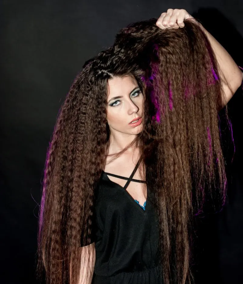 Model Inashan poses before styling box braids on her Caucasian hair