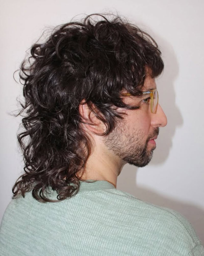thick shaggy curls styled into a modern mullet