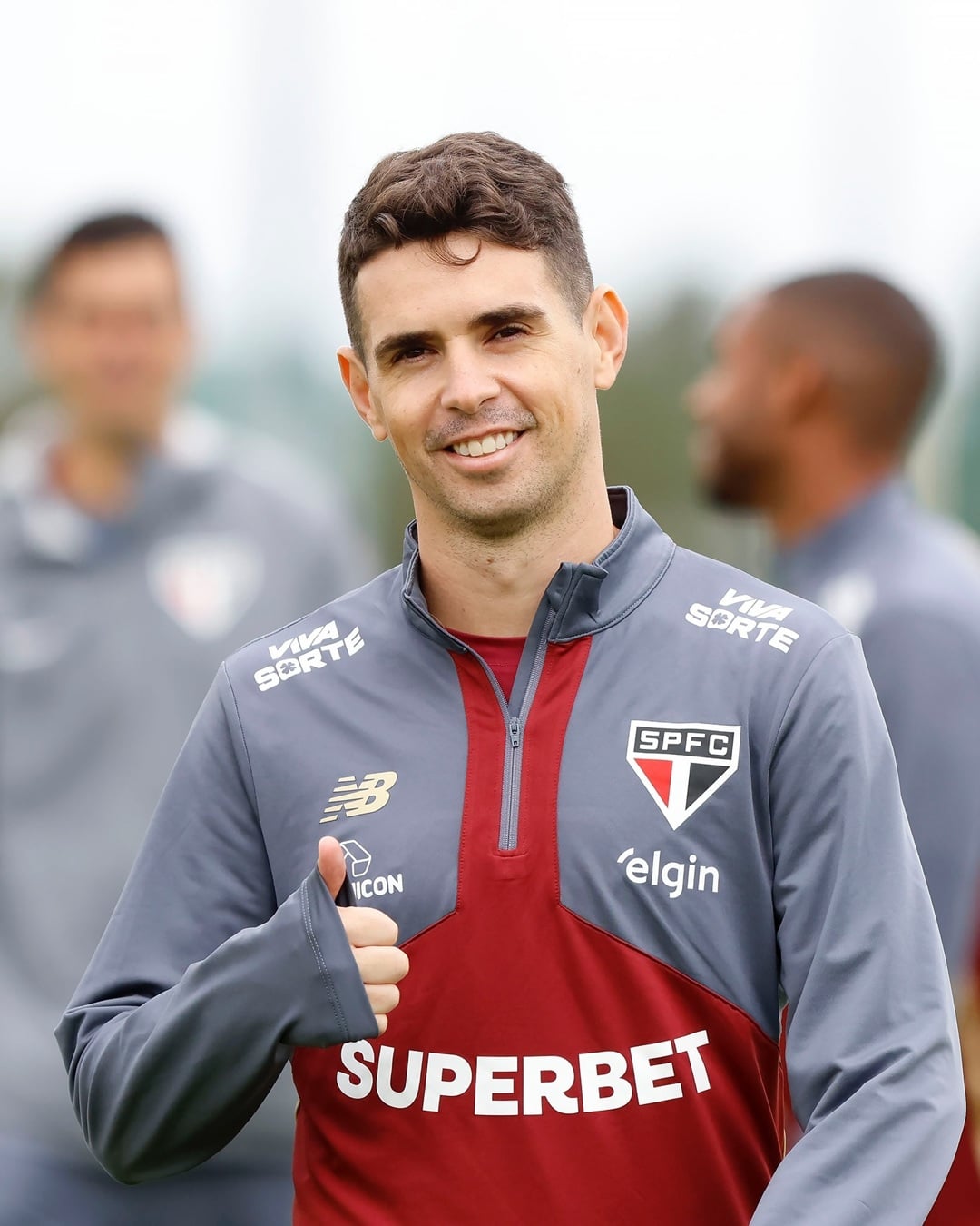 Oscar Emboaba with a short wavy haircut featuring tapered sides