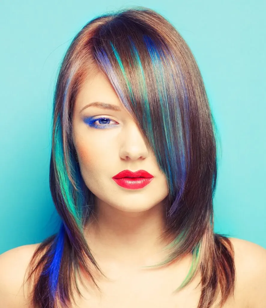 Pastel blue highlights on brown hair