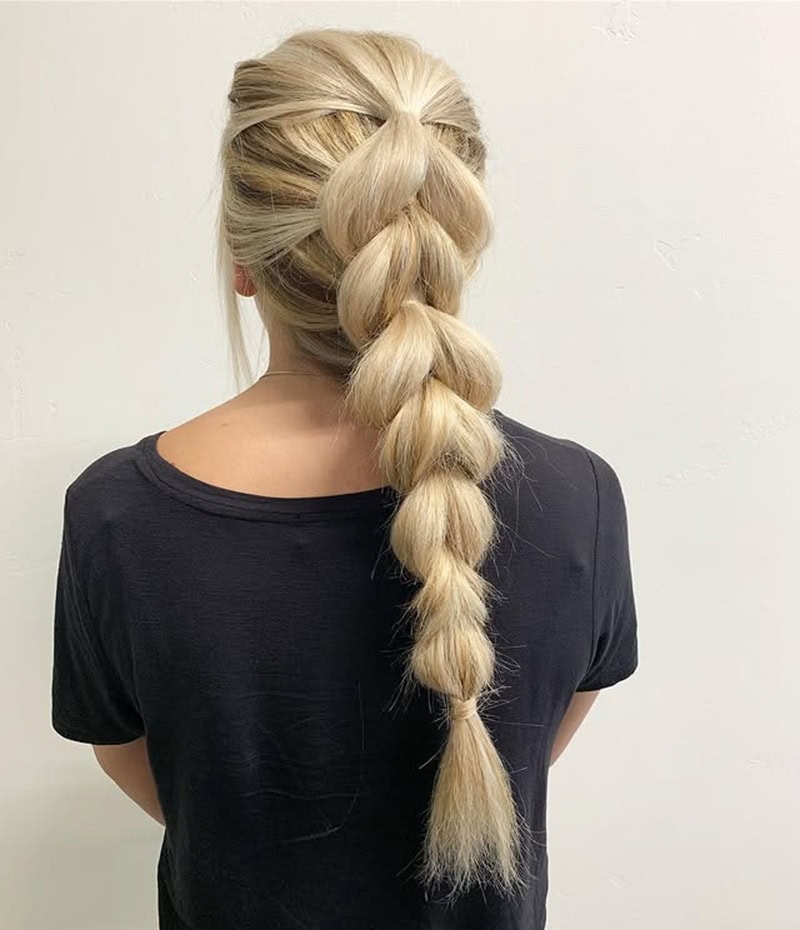Voluminous blonde pull-through ponytail