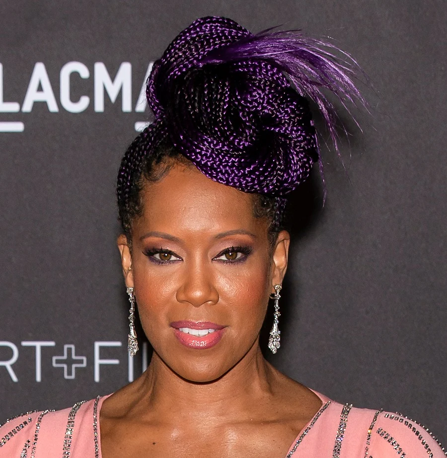 Regina King with purple braided updo