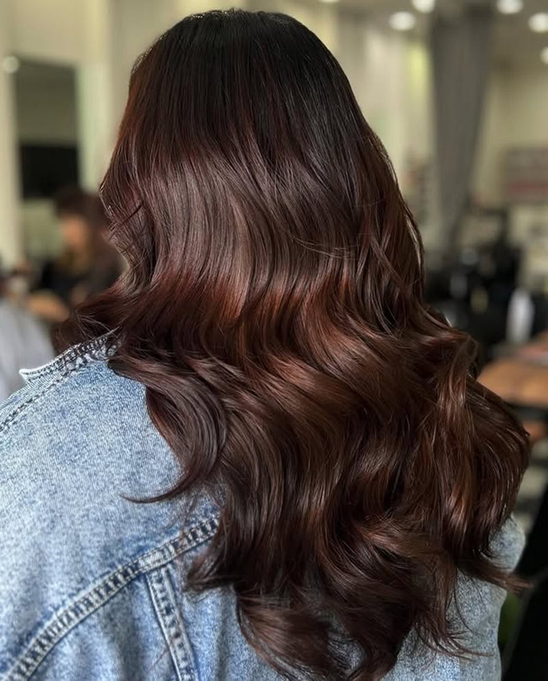 long dark hair in rich chocolate brown color with soft waves