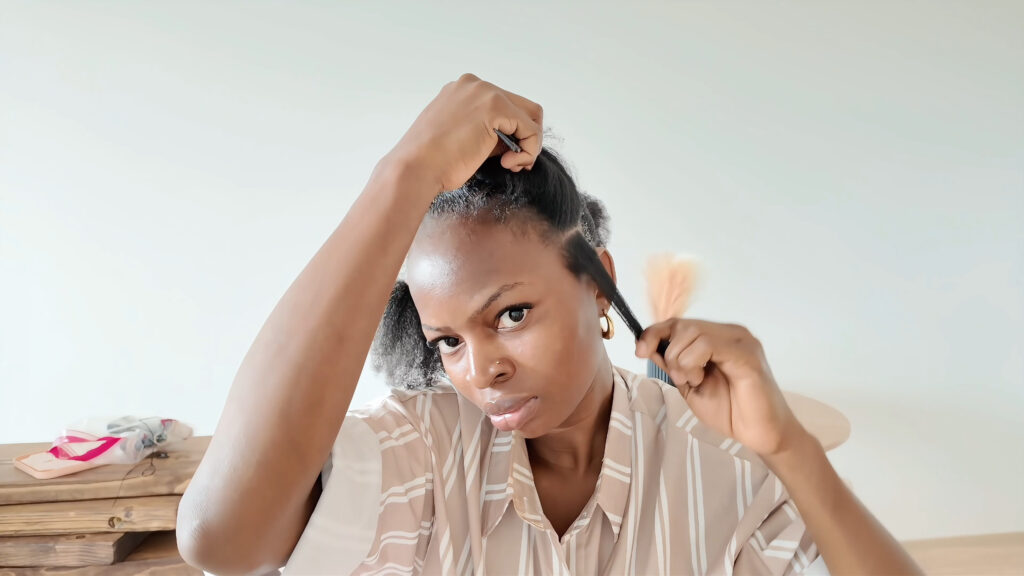 A thin section parted near the ear to create the slim face framing side braid